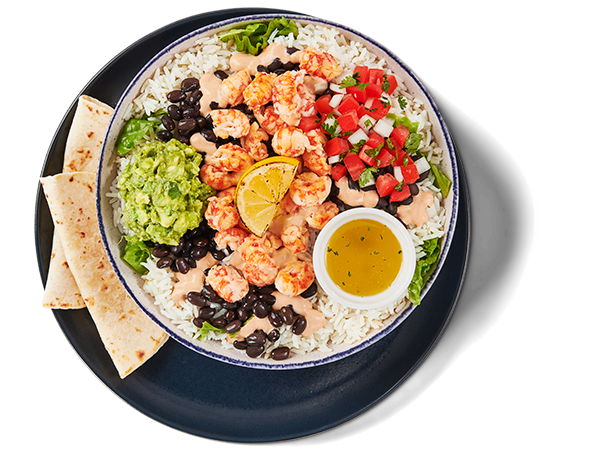 Bowl with rice, crawfish, black beans, guacamole, pico de gallo, dressing, and tortillas.